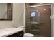 Clean bathroom featuring an accessible shower with safety bar, updated vanity, and framed mirror at 10843 Sw 91St Ter, Ocala, FL 34481
