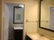 Bright bathroom with a new-looking vanity, dual mirrors, updated fixtures, and a white toilet at 10843 Sw 91St Ter, Ocala, FL 34481