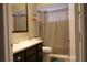 Neutral bathroom featuring a shower, toilet, and single vanity at 10843 Sw 91St Ter, Ocala, FL 34481