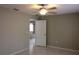 Comfortable bedroom with a ceiling fan and neutral color scheme, offers a peaceful retreat for relaxation at 10843 Sw 91St Ter, Ocala, FL 34481