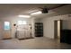 Garage featuring a door to the outside, a washer and dryer, shelving, and storage at 10843 Sw 91St Ter, Ocala, FL 34481