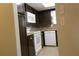 Efficient kitchen featuring ample cabinet space, white appliances, and stylish backsplash for easy meals at 10843 Sw 91St Ter, Ocala, FL 34481