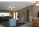 Spacious living room with vaulted ceiling, multiple seating areas, and views to the outside at 10843 Sw 91St Ter, Ocala, FL 34481