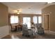 Bright living room showcasing an open floor plan with dining area, comfortable seating, and ample natural light at 10843 Sw 91St Ter, Ocala, FL 34481