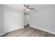 This bedroom has a ceiling fan, a closet and light gray walls, all freshly painted at 13349 Sw 113Th Pl, Dunnellon, FL 34432