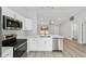 New kitchen boasts stainless appliances, quartz countertops, and eat-in dining at 13349 Sw 113Th Pl, Dunnellon, FL 34432