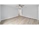 Large main bedroom with neutral paint, ceiling fan and plank flooring at 13349 Sw 113Th Pl, Dunnellon, FL 34432