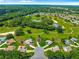 Birds eye view of the neighborhood and home nestled in a mature, well-maintained 55+ golf community at 13885 Del Webb Blvd, Summerfield, FL 34491