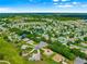 Stunning aerial view of the house nestled in a beautiful, active 55+ community at 13885 Del Webb Blvd, Summerfield, FL 34491