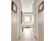 Hallway view of bathroom with a soaking tub at 13885 Del Webb Blvd, Summerfield, FL 34491