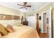 Bedroom with a four poster bed and closet at 13885 Del Webb Blvd, Summerfield, FL 34491
