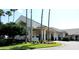 Exterior of the community center with immaculate landscaping in a lovely 55+ neighborhood at 13885 Del Webb Blvd, Summerfield, FL 34491