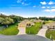 Inviting elevation with lush lawn and hardscape leading to the front door of the immaculate home at 13885 Del Webb Blvd, Summerfield, FL 34491