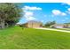 Charming home with a well-maintained lawn, mature trees, and a spacious driveway leading to a multi-car garage at 13885 Del Webb Blvd, Summerfield, FL 34491