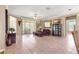 Spacious living room with tile flooring and access to the outdoor patio at 13885 Del Webb Blvd, Summerfield, FL 34491
