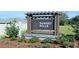 Decorative Sunset Hills community sign with landscaped surroundings at 15838 Se 101St Cir, Summerfield, FL 34491