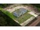 Aerial view of home, set on a spacious lot surrounded by lush greenery at 16231 Sw 20Th Ln, Ocala, FL 34481