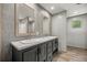 Stylish bathroom with a double vanity, sleek mirrors, and modern fixtures at 16231 Sw 20Th Ln, Ocala, FL 34481