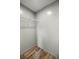 A closet featuring wood-look floors and wire shelving at 16231 Sw 20Th Ln, Ocala, FL 34481