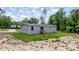 Exterior of the house showing the back entry and steps and the large lot at 16231 Sw 20Th Ln, Ocala, FL 34481