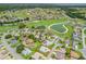 Residential community on a golf course with multiple homes, ponds, and green spaces. Property outlined in red at 17755 Se 117Th Cir, Summerfield, FL 34491