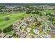 Residential community on a golf course with multiple homes and green spaces. Property outlined in red at 17755 Se 117Th Cir, Summerfield, FL 34491