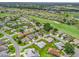 Residential community on a golf course with multiple homes and green spaces. Property outlined in red at 17755 Se 117Th Cir, Summerfield, FL 34491