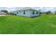 Well-maintained backyard with lush green grass, offering ample space for outdoor enjoyment at 17755 Se 117Th Cir, Summerfield, FL 34491