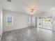 Bedroom with tile floors, natural light, and sliding glass doors to the screened patio at 17755 Se 117Th Cir, Summerfield, FL 34491
