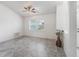Cozy bedroom with tile flooring, a ceiling fan, and a window that provides natural light at 17755 Se 117Th Cir, Summerfield, FL 34491
