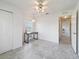 Bright dining area features tile floors, ceiling fan, and space for a desk near the window at 17755 Se 117Th Cir, Summerfield, FL 34491