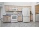 Cozy kitchen features sleek appliances, tile flooring, and ample cabinet space at 17755 Se 117Th Cir, Summerfield, FL 34491