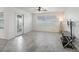 Bright living room with tile floors, large windows, and a glass door to the patio at 17755 Se 117Th Cir, Summerfield, FL 34491
