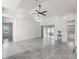 Open living space with tile flooring, high ceilings and sliding glass doors leading to the screened-in lanai at 17755 Se 117Th Cir, Summerfield, FL 34491