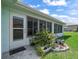 Enclosed patio featuring tiled floors and windows along the exterior for natural light at 17755 Se 117Th Cir, Summerfield, FL 34491