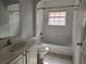 Bathroom featuring a shower-tub combo and tiled floors at 17974 Se 115Th Cir, Summerfield, FL 34491