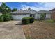 Charming single-story home featuring a two-car garage and low-maintenance landscaping at 17974 Se 115Th Cir, Summerfield, FL 34491