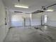 Attached garage featuring utility access and additional interior entry at 17974 Se 115Th Cir, Summerfield, FL 34491