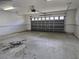 Spacious garage with overhead door and ample room for storage at 17974 Se 115Th Cir, Summerfield, FL 34491
