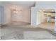 Spacious living room with open access to kitchen and front entrance at 17974 Se 115Th Cir, Summerfield, FL 34491