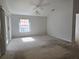 Spacious main bedroom featuring sliding glass doors at 17974 Se 115Th Cir, Summerfield, FL 34491