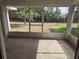 Enclosed patio with concrete flooring and a view of the backyard at 17974 Se 115Th Cir, Summerfield, FL 34491
