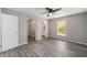 Bedroom featuring a closet, wood-look floors, a window and neutral walls at 23163 Nw Shamrock Ave, Dunnellon, FL 34431