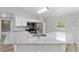 Bright kitchen with granite countertops and stainless steel appliances at 23163 Nw Shamrock Ave, Dunnellon, FL 34431