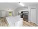 Open kitchen features granite counters, stainless appliances, and a view to the living area at 23163 Nw Shamrock Ave, Dunnellon, FL 34431