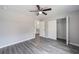 Charming bedroom featuring wood flooring, a ceiling fan, and a closet for organized storage at 24144 Nw Water Oak Ave, Dunnellon, FL 34431