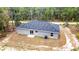 Modern home featuring a new roof, a sliding glass door and exterior unit with an attractive gray stucco finish at 24144 Nw Water Oak Ave, Dunnellon, FL 34431