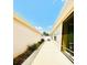 Backyard walkway showcasing manicured landscaping and privacy fencing at 3023 Charlevoix St, The Villages, FL 32163