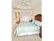 This bedroom offers neutral carpeting and a double door closet at 3023 Charlevoix St, The Villages, FL 32163