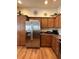 Modern kitchen featuring stainless steel appliances and ample cabinet space at 3023 Charlevoix St, The Villages, FL 32163